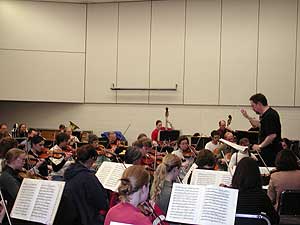 
SCSO musicians credit conductor Bill Schrickel's tough rehearsals and challenging pieces with raising the orchestra's musical standard. (MPR photo/Annie Baxter)