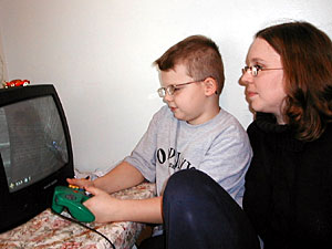 
 Connor's diagnoses don't get him off the hook. He's been in trouble for threatening classmates and recently after a tough day at school, he talked openly while playing his videogame about his desire to hurt people. 

 (MPR Photo/Lorna Benson)