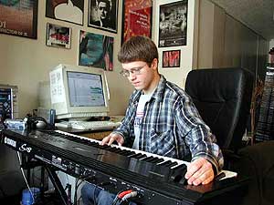 
Ryan Rapsys uses an electronic keyboard and a computer to arrange and change found sounds. (MPR Photo/Stephanie Hemphill)