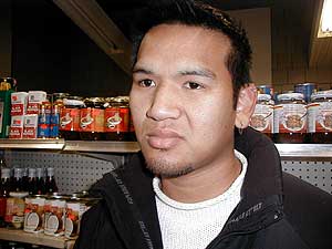 
L.A. Phomsatry of Worthington.  He says people drive for 
miles to shop at his family's Asian grocery store.   (MPR Photo/Mark Steil)