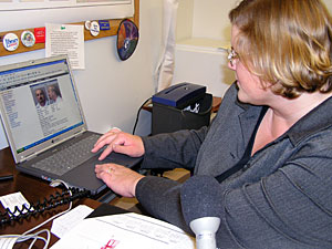 
State Rep. Deb Hilstrom checks the Corrections Department Web site for information on a Level 3 sex offender in her community.  (MPR Photo/Laura McCallum)