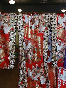 
Embroidered kimonos are most popular in Japan.  This kimono is adorned with with cranes, a symbol of fidelity, longevity and good luck. (MPR Photo/Erin Galbally)