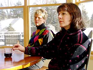 
Sheryl Walker and Mary Hall, both parents of Hopkins school district students, listen to the STAR Fund pitch. (MPR Photo/Tim Pugmire)