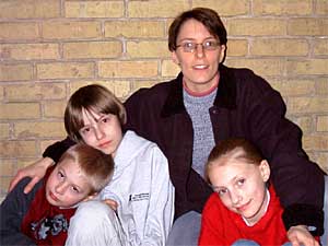 
Little Falls Public School parent Mary Warner with her children (left to right), Sebastian, Ian and Olivia, says many fundraisers waste classroom time and exploit students. (Photo courtesy of Erik Warner)