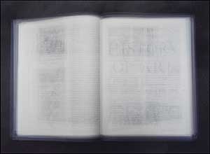
Artist Doug Keyes' photographs are the results of long exposures. Keyes opens the camera's shutter, then turns the book's pages several times. The final image appears almost three dimensional, as though the viewer could absorb the entire contents of the book if they stared long and hard enough. (Photo by Doug Keyes)