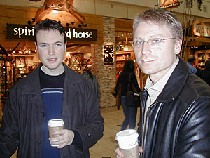 
Sean Gentry, left, and Bob Zimmerman are waiting for flights in Minneapolis-St. Paul International Airport.  Gentry says in passenger screening it should be "very clear" where personal passenger information is going. Zimmerman says he'd prefer personal information be kept out of it. (MPR Photo/Jeff Horwich)