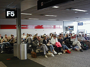 
Federal officials say passenger screening would be streamlined under CAPPS II. Here, passengers wait for a recent flight in Minneapolis-St. Paul International Airport. (MPR Photo/Jeff Horwich)