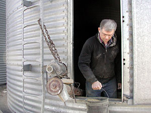 
Senator Dille gets ready to feed his animals on his farm just outside Dassel. (MPR Photo/Annie Baxter)