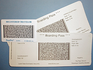 
These sample boarding passes and registered travler card were generated by the PassPro system.  The barcode contains a picture, scrambled algorithm of the traveler's fingerprint, an image of the bag, and more. (MPR Photo/Jeff Horwich)