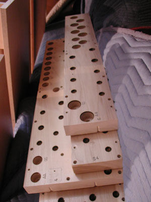 
"Toe boards."  The "foot" or narrowed bottom of an organ pipe fits into each hole on a toe board. (MPR Photo/Valerie Kahler)