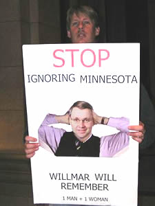 
A  protestor camped outside the office of Senate Majority Leader Dean Johnson, chastising him for not allowing a vote on bannging same-sex marriage. (MPR Photo/Laura McCallum)