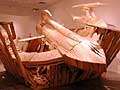 "Untitled," Chris Larson's sculpture depicting the crash of a spaceship into a wooden shack. Its focus on modern subjects and situations represents a new direction in Larson's work. Before, he concentrated mainly on creating imaginary machines from some bygone era. (MPR Photo/Chris Roberts)