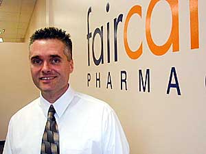 
Dan Lannon studied at the University of Minnesota and has practiced as a pharmacist in the Twin Cities since 1988.  Over the 11 years he has owned his own pharmacy in West St. Paul, he says he grew frustrated with how the uninsured bore "the brunt of the way the HMOs do business." (MPR Photo/Jeff Horwich)
