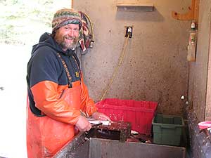 
Dahl cleans his catch and delivers it to restaurants and fish houses between Duluth and Two Harbors.  There are about two dozen commercial fishermen along the North Shore of Lake Superior. (MPR Photo/Stephanie Hemphill)