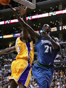 Kevin Garnett of the Minnesota Timberwolves attempts a dunk against News  Photo - Getty Images