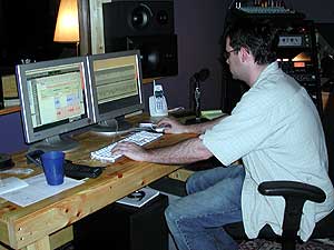 
Matt Hupton mixes a new song for the CD. (MPR photo/Annie Feidt)