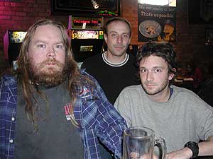 
Loyal Triple Rock customers Mark, Mike and Anthony. Mark is a non-smoker, but still opposes a Minneapolis smoking ban. Mike and Anthony say a ban will force them to be more choosy about what bands they see, and how long they stay at the bar. (MPR photo/Chris Roberts)