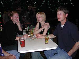 
Turf Club patrons Brenda, Shelly and Eric. All three are pretty heavy smokers, but believe a smoking ban in bars and restaurants is the right thing to do. (MPR photo/Chris Roberts)