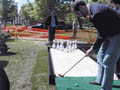 Dominic Papatola takes aim on the new course (MPR photo/Kathy Cristobal)