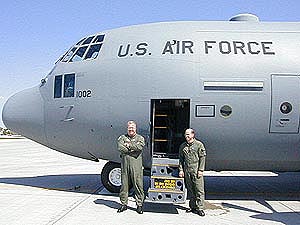 
Lt. Col. Steve O'Brien and Master Sgt. Jeffrey Rosenthal next to a Minnesota Air National Guard C-130. (MPR Photo/Bill Catlin)