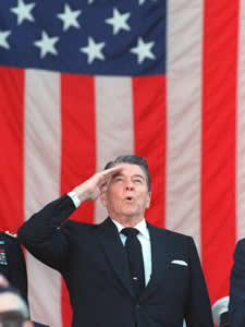 
This  November 11, 1988 file photo shows then U.S. President Ronald Reagan saluting during the Pledge Of Allegiance at a Veterans Day ceremony at Arlington National Cemetery. (Photo:  JEROME DELAY/AFP/Getty Images)