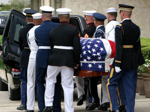 
 With a simple ceremony, the coffin was placed in a hearse, which
set out in a motorcade on the drive to the nearby Navy base at
Point Mugu for a flight to Andrews Air Force Base near Washington
aboard a presidential Boeing 747.
 (Photo by Pool/Getty Images)