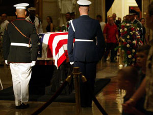
  The general public files past the flag draped casket of former U.S. President Ronald Reagan to pay their final respects in the Capitol Rotunda. (Photo by Alex Wong/Getty Images)