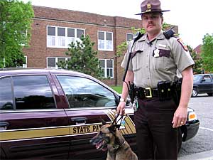 
Minnesota State Patrol Trooper Rich Homan is on the lookout for speeding drivers in west central Minnesota. But he also knows almost any traffic spot can turn into a search for drugs.  In recent years, Homan and his drug dog Malou have seen more meth move into rural Minnesota.  (MPR Photo/Tim Post)