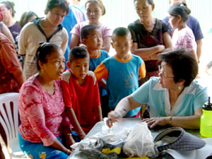 
Screeners spoke to female refugees at the camp about mental health issues, but had some difficulty having candid conversations with them since their children also crowded around.  (Photo courtesy of Dr. Patricia Walker)