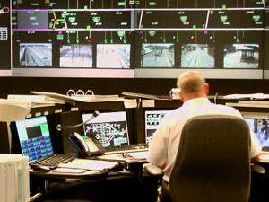 
A dispatcher watches over a computerized layout of all the trains on the track. (MPR Photo/Art Hughes)
