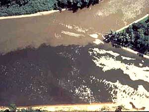 
The confluence of the Minnesota and Mississippi Rivers. This photo illustrates the pollution and sediment that is contained in the Minnesota, and dumped here into the Mississippi. The Minnesota has been called the state's dirtiest river.  (Photo courtesy of the MPCA)