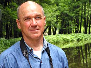
Fred Lesher has been tracking bird life on the Mississippi since he was a boy during World War II.  Lesher says his favorite time of year is fall, when thousands of birds use the Mississippi as an interestate flyway. (MPR Photo/Erin Galbally)