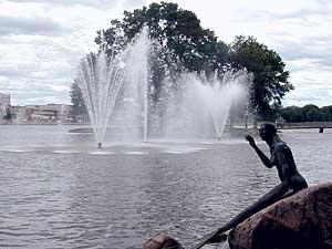 
Fountain Lake was recently adorned with these three fountains, and the mermaid sculpture in the foreground. (MPR Photo/Jeff Jones)