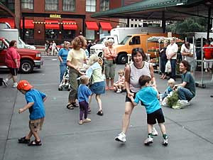 
Shoppers at St. Paul farmers market put down shopping bags and dance to Skalmusik tunes at a recent performance (MPR photo/Dan Olson)