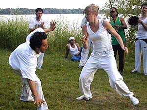
Capoerista Nora Hoen, a former volleyball player, says she enjoys capoeira more because it's not just a sport -- it has a history and culture all its own.  (MPR Photo/Annie Feidt)
