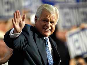 
U.S. Sen. Ted Kennedy waves to the crowd after delivering a
blunt criticism of President Bush's handling of the Iraq war, which he called misguided.  (Photo by Scott Olson/Getty Images)