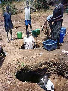 
These women are digging holes in a dry riverbed, in search of water.  (Photo by Doug McGill)
