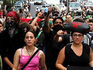 
Anti-war demonstrators march towards the FleetCenter, the site of the Democratic National Convention, on Thursday. (Photo by William B. Plowman/Getty Images)