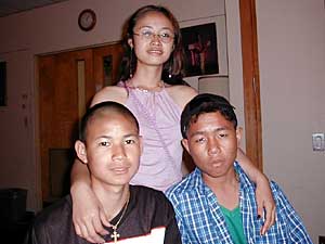 
Christopher, 14, and Wah Wah, 20, on the left have been in Minnesota 4 years and Dah Dah, 11, arrived 2 months ago.  (MPR photo/Dan Olson)