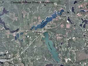 
The Canisteo pit can be seen just above the towns of Bovey and Coleraine.  One plan is to drain several feet of water from the pit into Trout Lake, south of the towns, and into a nearby river.   (Photo courtesy of the Minnesota DNR)