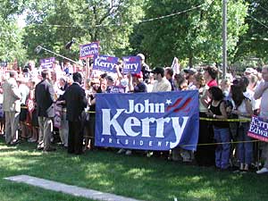 
Several dozen Kerry/Edwards supporters were on hand, but they were kept behind a security rope in a park across the street from the Fogarty house.  (MPR Photo/William Wilcoxen)