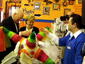 
Vice President Cheney has made several campaign trips to the region in the past few months. During a stop in St. Paul in February, the Cheneys toured the El Burrito Mercado Restaurant and bought a pinata.  (MPR file photo)
