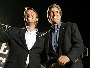 
John Kerry and his running mate John Edwards attend a rally in Springfield, Ohio, late Thursday night. Kerry launched a furious response to the Republican onslaught on his record. "I'm not going to have my commitment to defend this country questioned by those who have refused to serve when they could have, and by those who have misled the nation into Iraq," Kerry said. (Photo by HECTOR MATA/AFP/Getty Images)