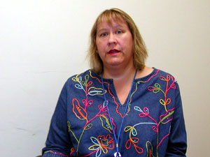 
Hennepin County child support officer Deb Brunsberg has seen a rise in demand for public assistance while her own wages have stagnated and her benefits have fallen.  (MPR Photo/Andrew Haeg)