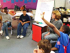 
Lynn Hisdahl and her sixth grade students talk about behavior issues.  (MPR Photo/Tim Pugmire)