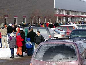 
People waited in long lines to get a flu shot during last year's flu season, when the vaccine also was in short supply. Health officials say this year's flu bug is not expected to be as severe as last year. (MPR file photo)