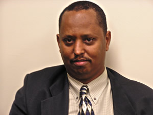 
Abdi Mohamed leans towards Kerry in matters concerning the economy and the war in Iraq. But on social issues, he aligns himself with Bush. (MPR Photo/ Annie Baxter)