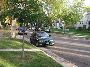 
The "1900" block of Juliet Avenue in St. Paul. With its canopy of trees and 20s-era homes, Juliet is like a post card of middle class America. (MPR photo/Chris Roberts)