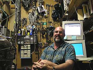 
Engineer Dan Houg shoehorns himself and his equipment into a closet-sized workroom. (MPR Photo/Stephanie Hemphill)