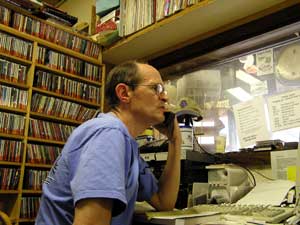 
Morning show host Scott Hall shares his office with an ever-expanding music library. (MPR Photo/Stephanie Hemphill)